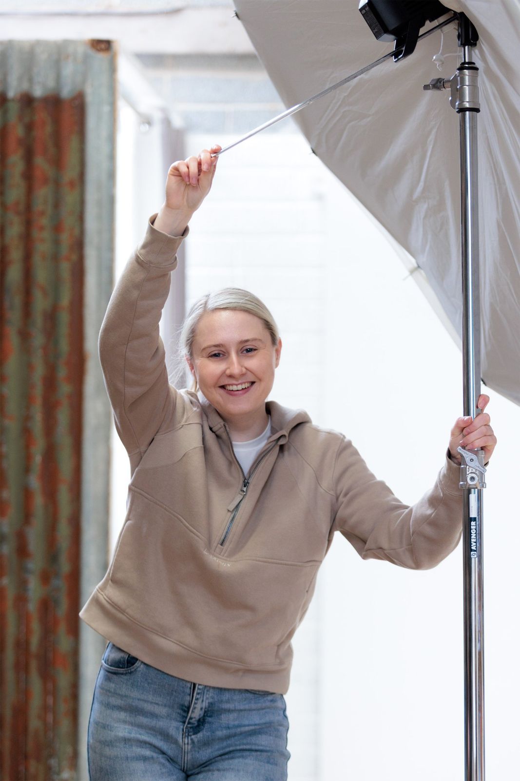 Victoria setting up a studio light